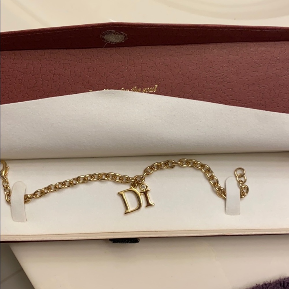 Di charm bracelet- gold tone- never worn